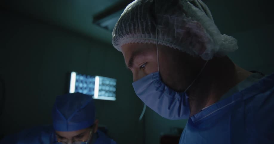 The doctors are working in the operating room