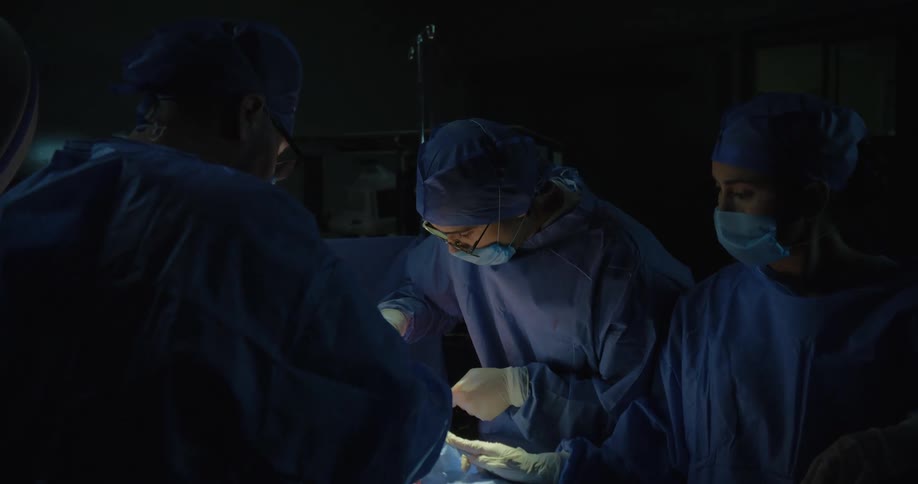 Doctors perform surgery on a patient