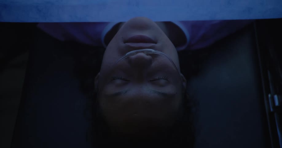 The patient is sleeping under the sheet