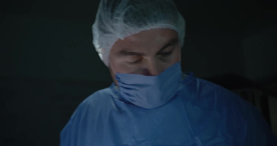 Man concentrating in an operating room