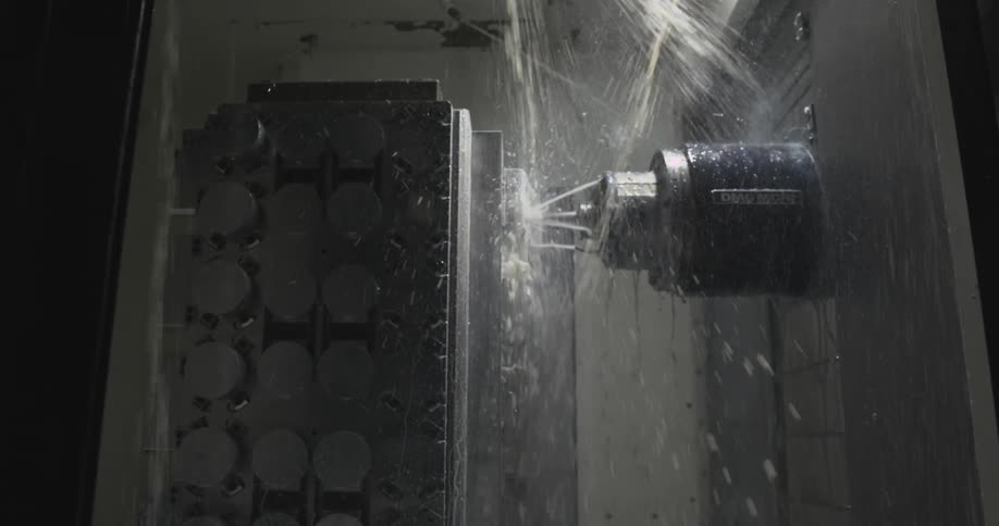 Inside a factory with water running down machinery