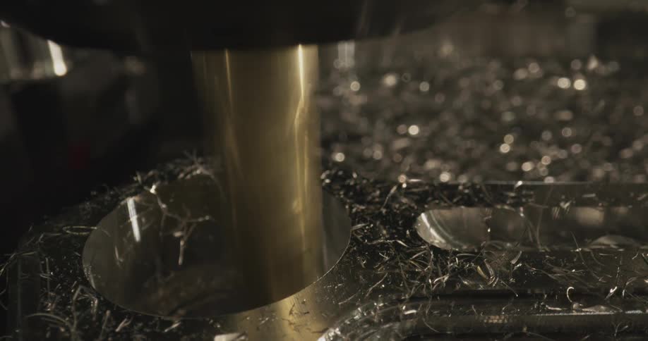 Industrial machine performing precise cutting on a metal