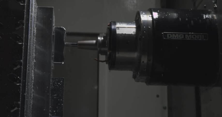 Precision cutting machine cutting a metal object
