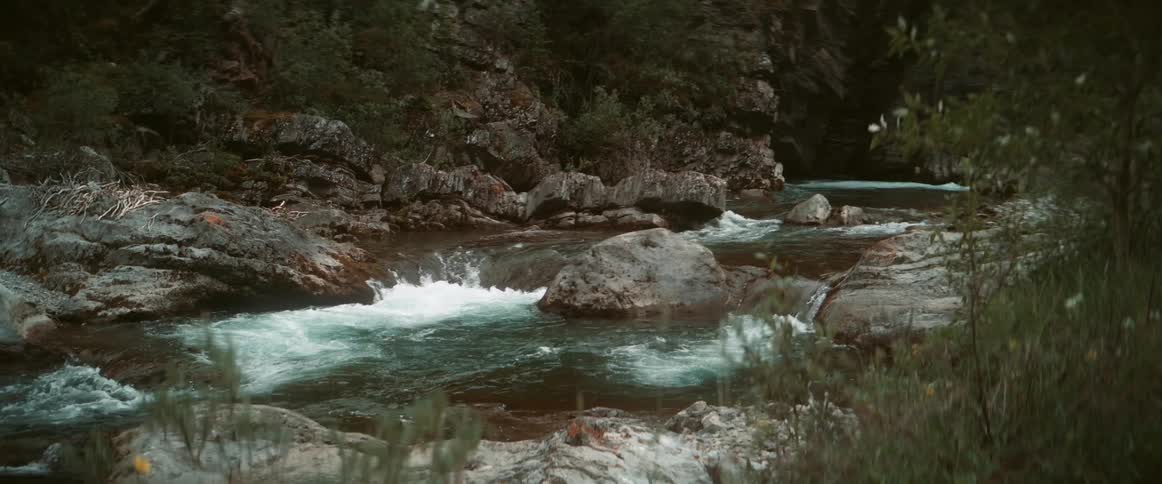 River flowing through rocks between the canyon in the wilderness