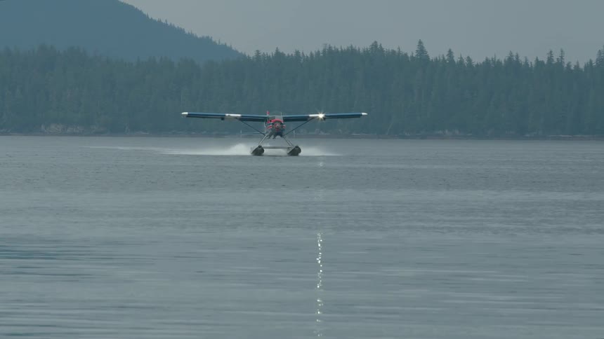 Water plane landing in the ocean