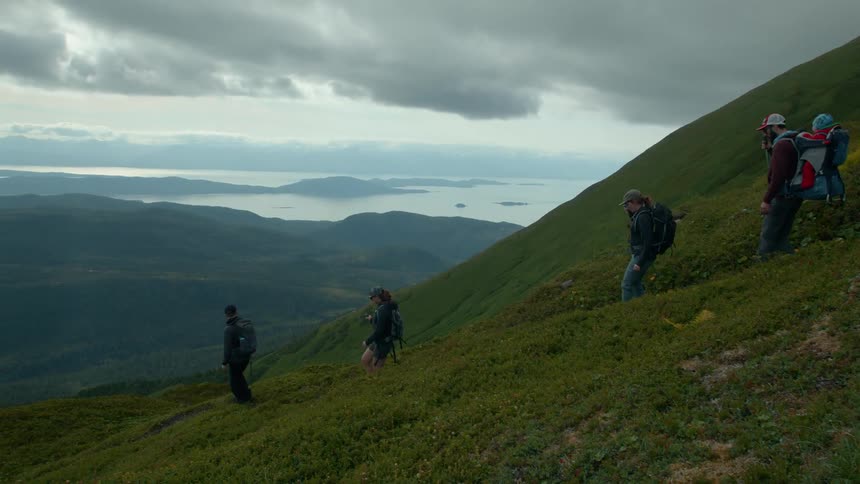 Group of four people descending a mountain