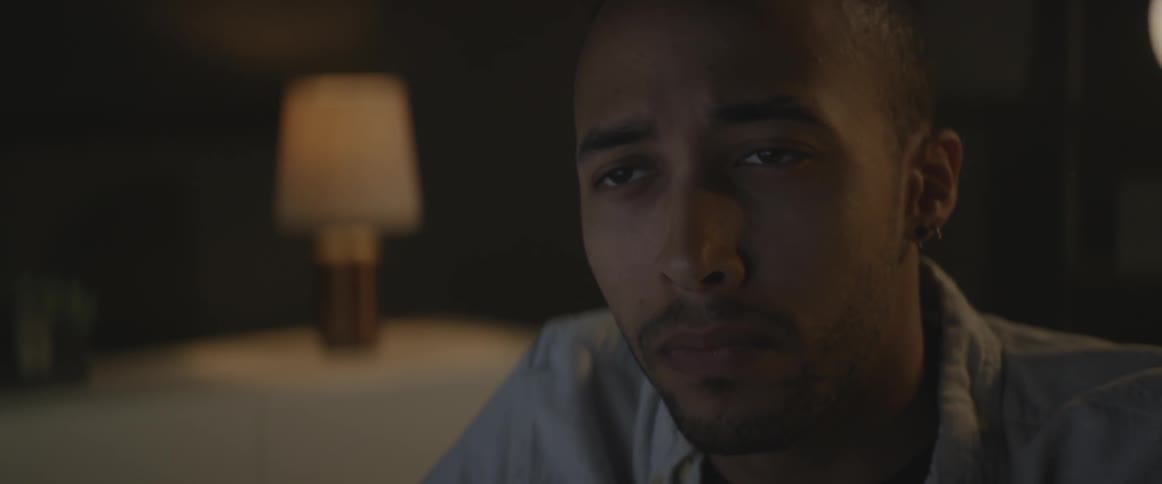 A man blinks looking forward