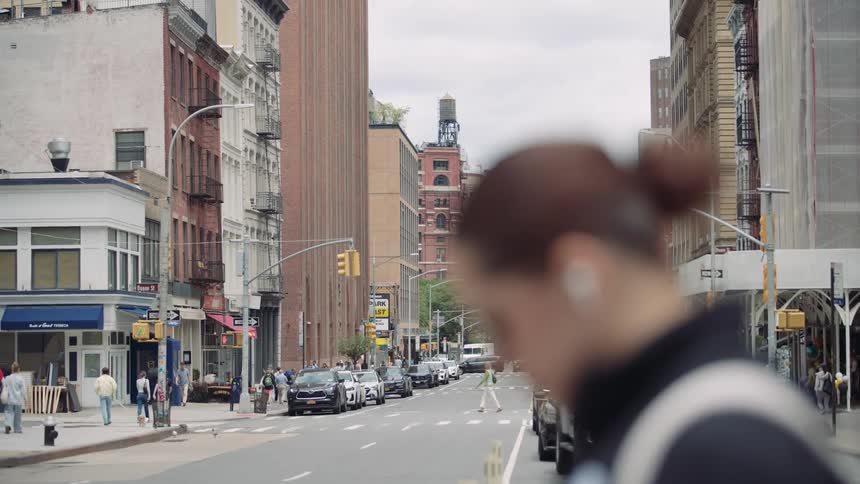 Pedestrians cross the street in the city