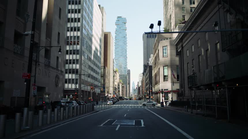Asphalt intersection in a metropolis with buildings