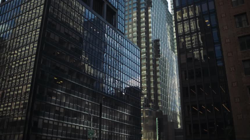 The side of the building is covered with reflective windows