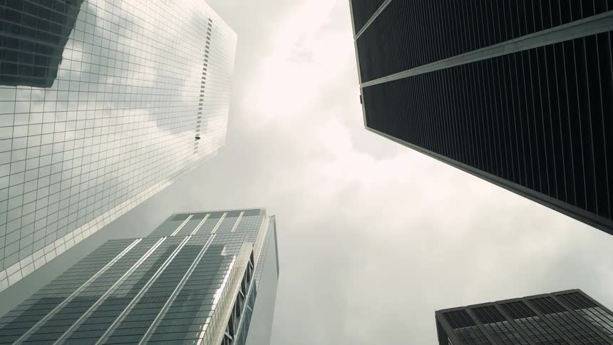 Skyscrapers standing tall in the urban city on a cloudy day