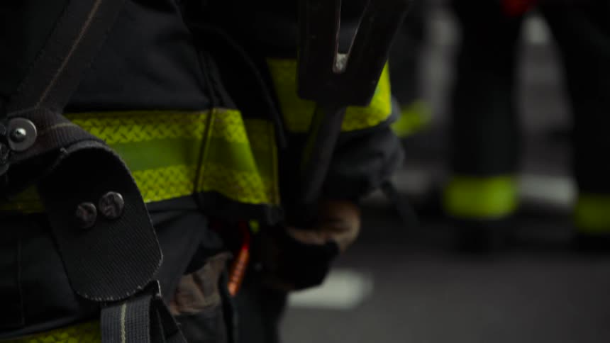 Firefighter holding a crowbar