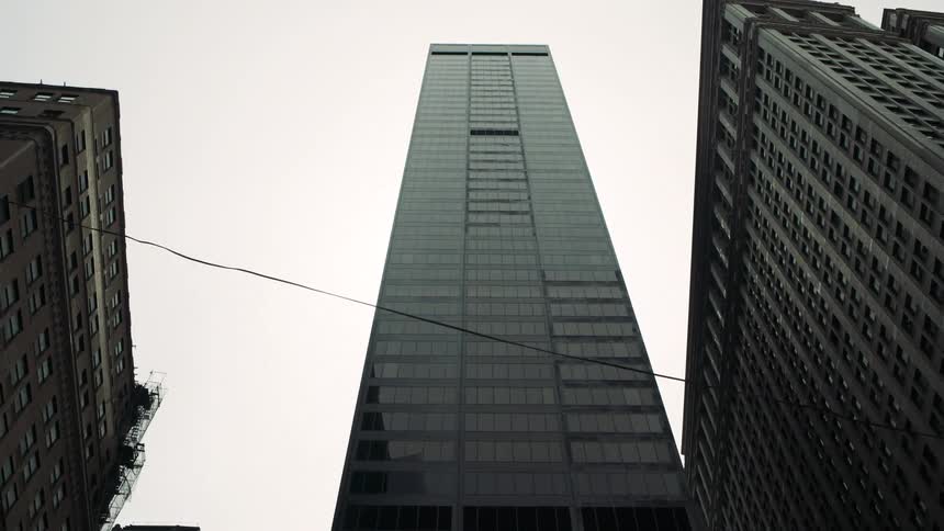 Tall skyscrapers touch the clouds
