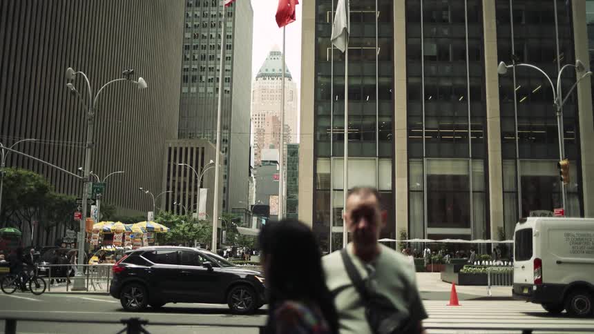 Streets of a metropolis with pedestrians and vehicle traffic
