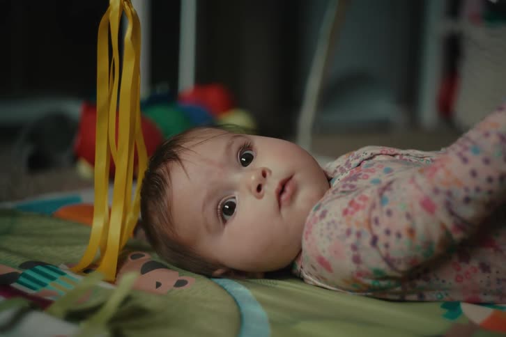 Baby lying on the carpet