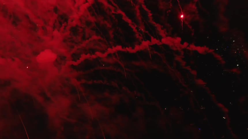 The sky is full of smoke and fireworks