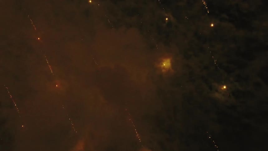 Fireworks explode in the night sky