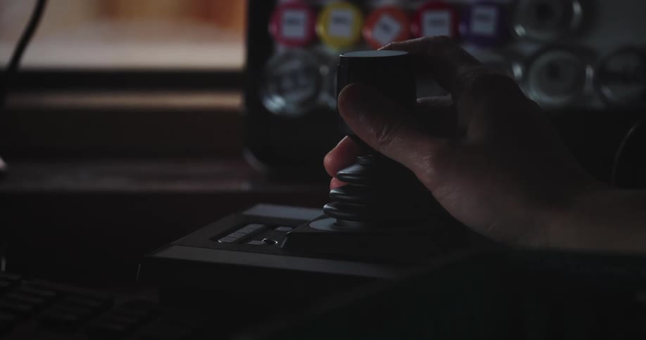 Close up of a hand handling a controller