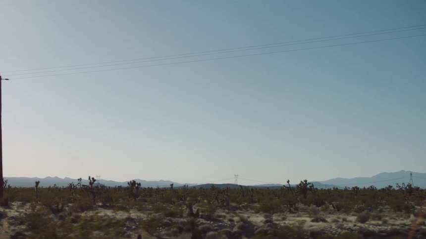 Low lying mountains viewed from a car