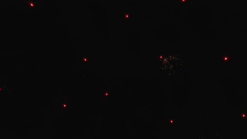 Fireworks shoot up into the night sky