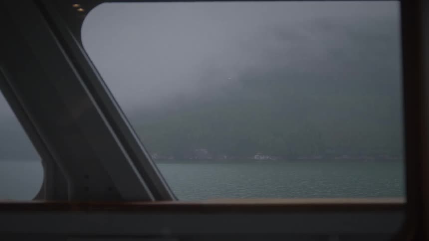 Heavy fog covers the shoreline