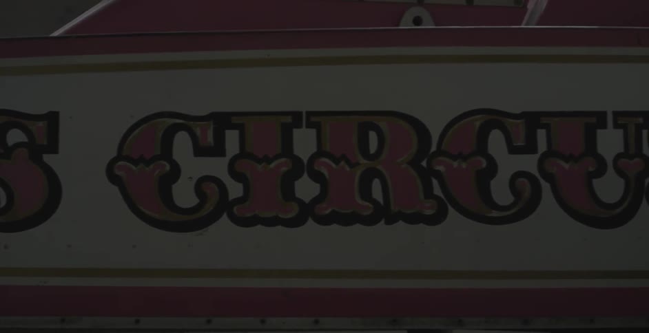A circus sign hangs