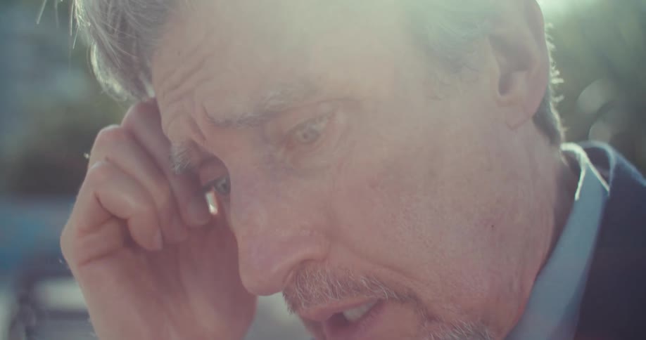 A man seeing something concerning on his cell phone