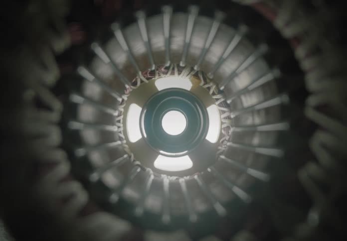 A symmetrical closeup view reveals the inside of a mechanical rotor or turbine