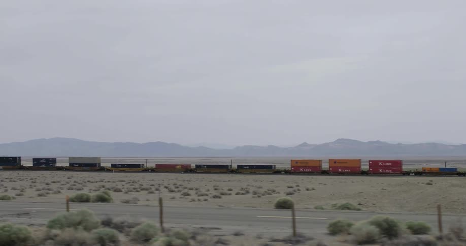 A train passing by a highway