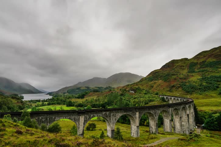 Steam train on raised viaduct, Scotland, Glenfinnian