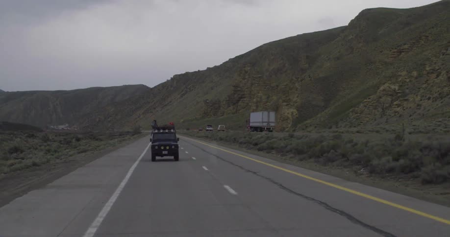 A vehicle drives down a divided highway