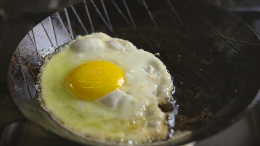Egg being fried in a frying pan