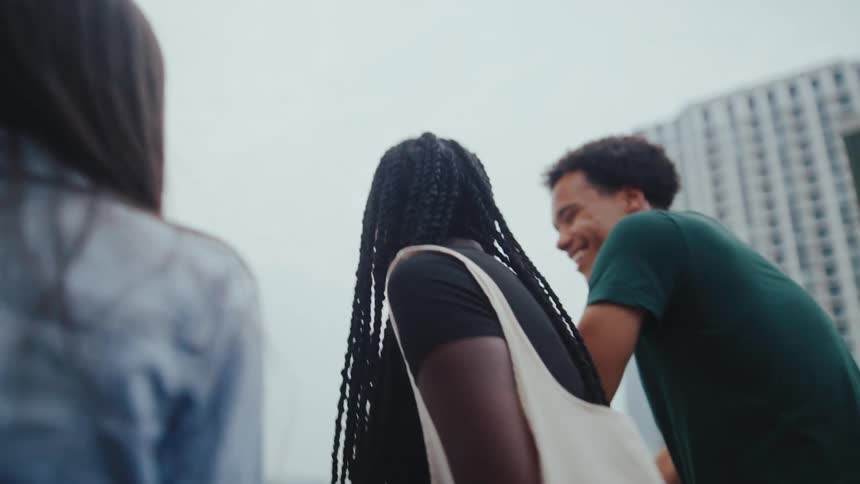 Group of friends in an outdoor setting talking smiling