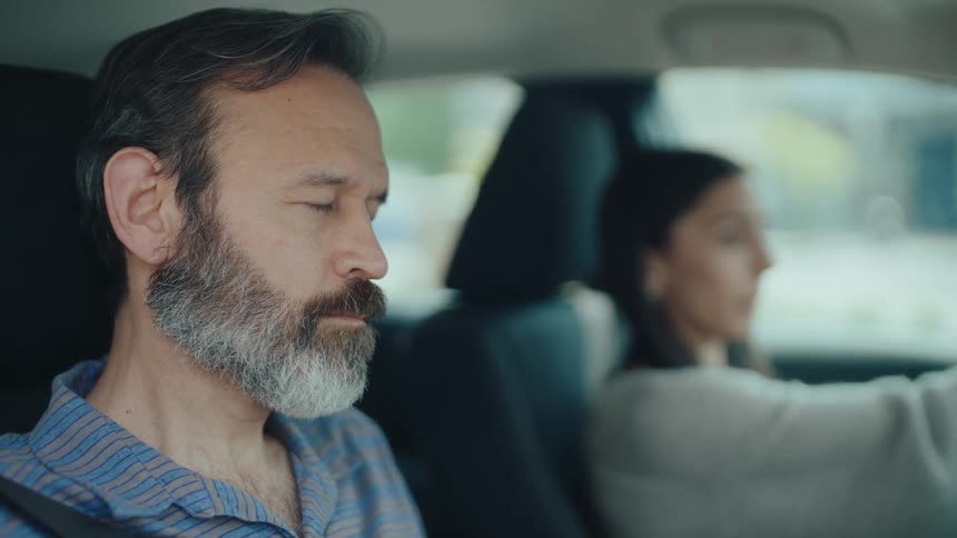 Instructor accompanying a woman driving