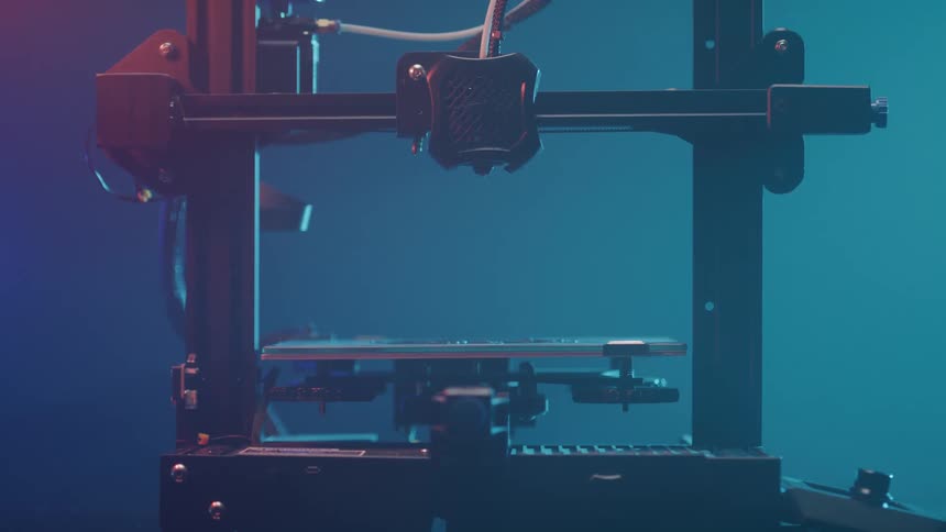The machine needle moves down to the board