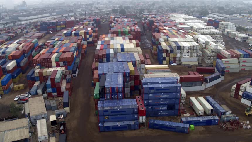 Fog hangs over the storage containers