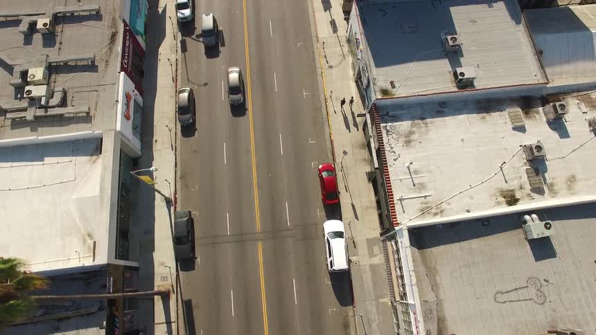 Light traffic flows down Melrose Avenue in Los Angeles
