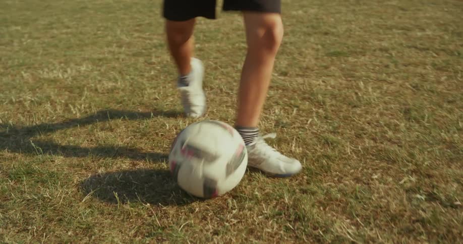 The soccer ball is kicked band and forth between two children