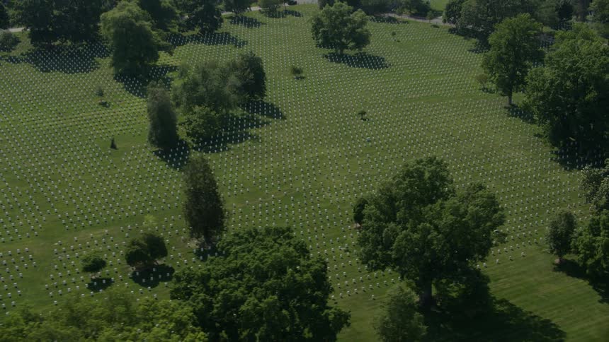 The field below is lined with graves