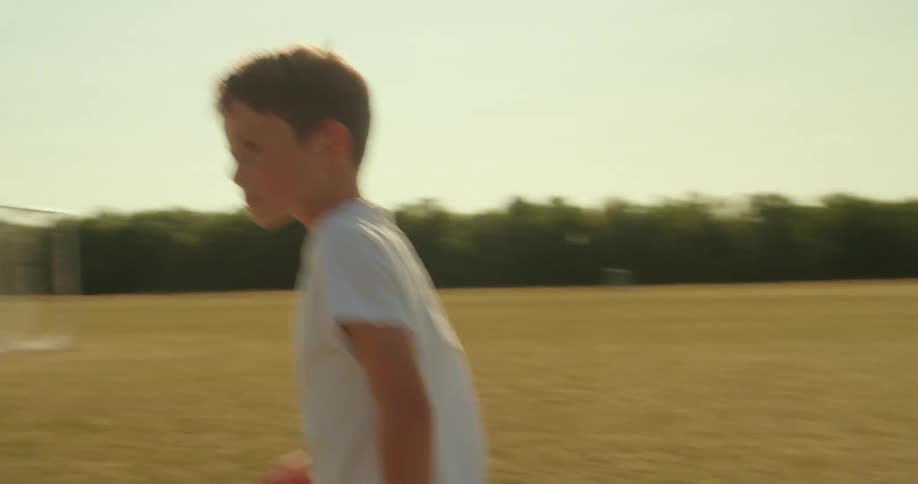 Children run and play soccer
