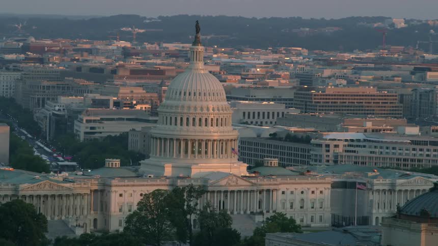 Capitol building surrounded by many buildings in Washington dc