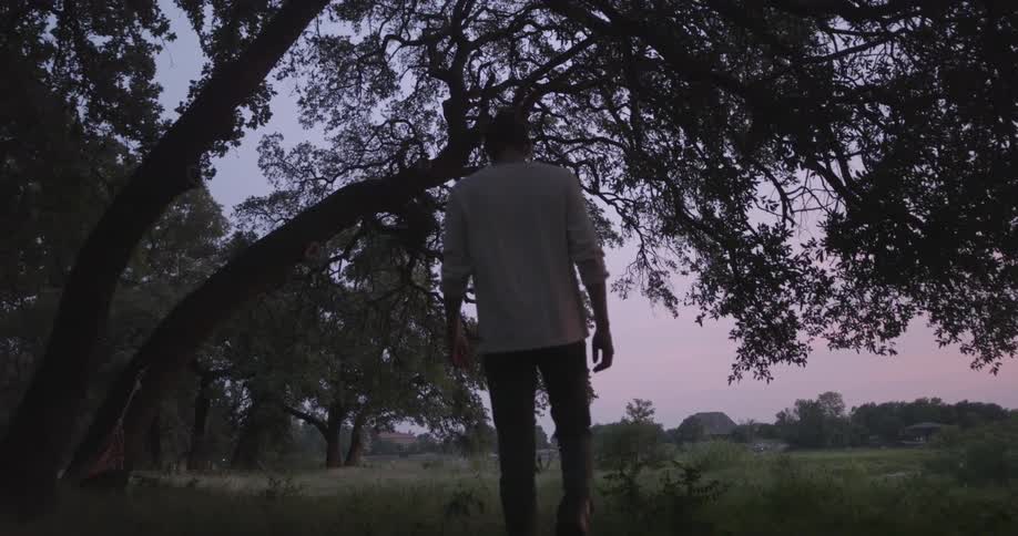 A person walking in the grass