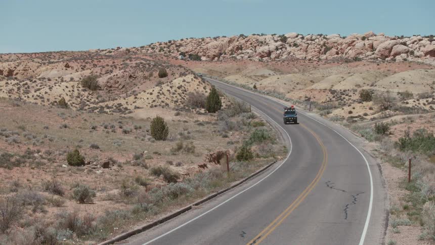 A jeep driving down the road