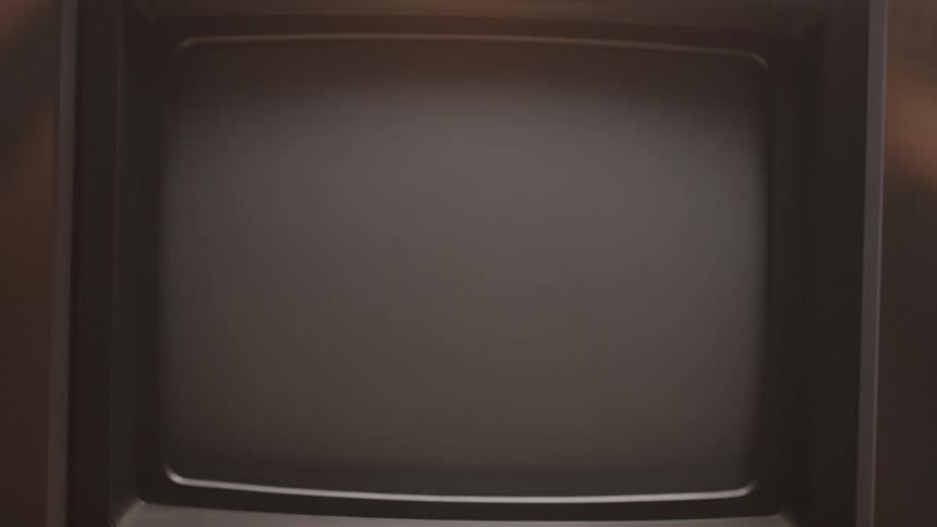 A television screen displays static noise and then turns off