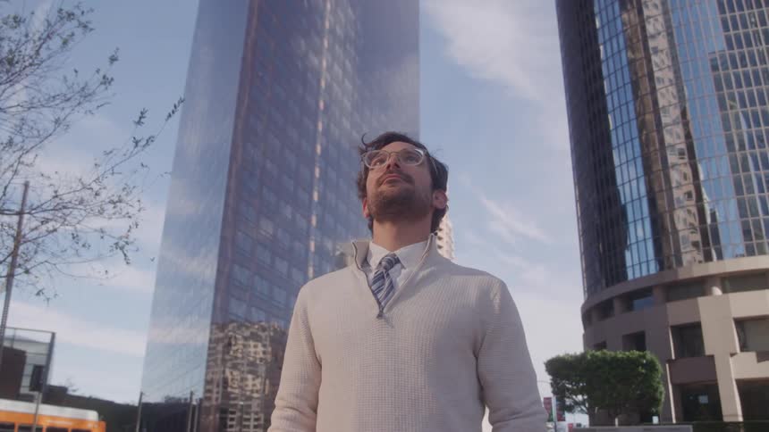A man stands in a city