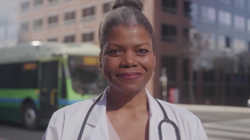 A nurse stands at an intersection