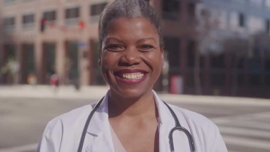 A nurse stands at an intersection