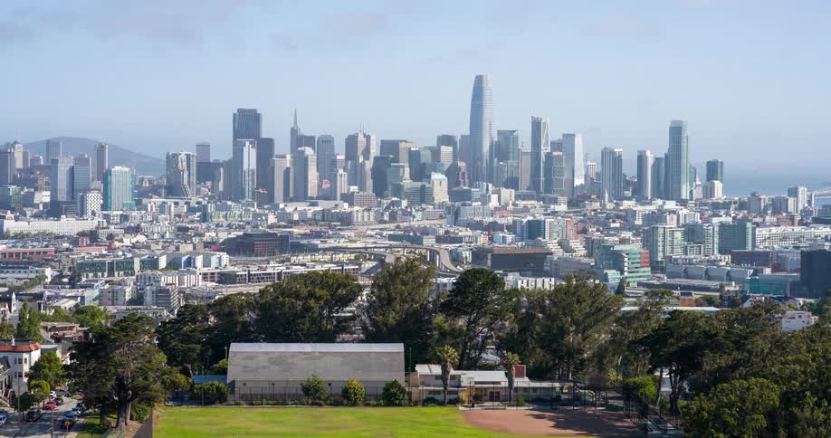 A baseball field is before the big city
