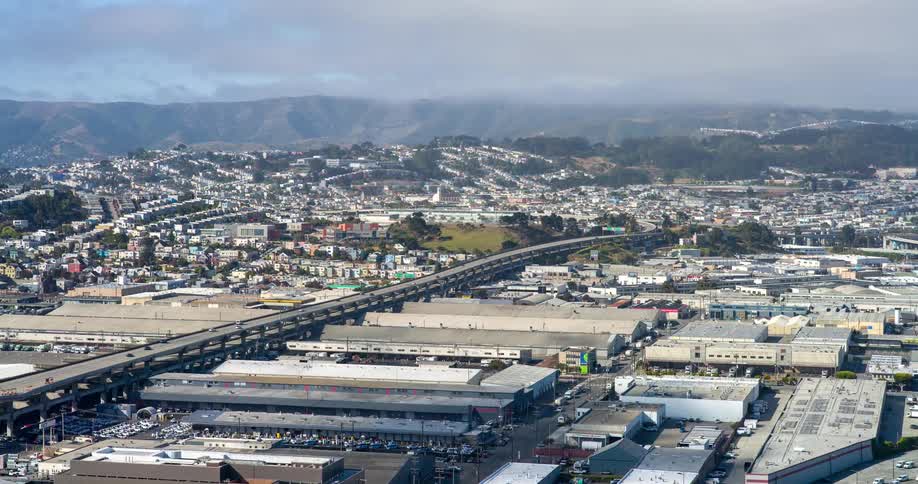 Warehouses are near the suburbs on the landscape