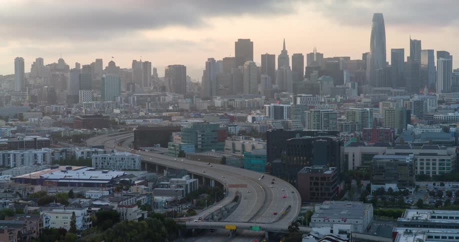 Aerial view of a viaduct with vehicle traffic and skyscrapers in a metropolis